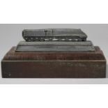 An official LNER streamline engine silver link pewter paperweight on a hardwood plinth issued by