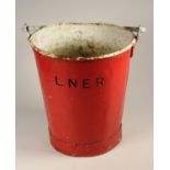 A red LNER fire bucket, marked LNER on one side and 'fire use only'