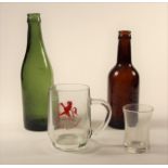 Two LMS 1/2 pint beer bottles in green and brown, a British Railways small glass tankard and a small