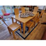 A Scandinavian style beech dining table with six laminated chairs, 160 x 90 x 72 cm.