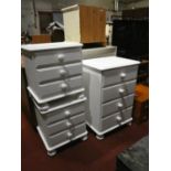 A pair of painted pine bedside 3 height chest of drawers, together with a matched 4 height painted
