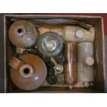 A collection of stoneware flagons, early ceramic hot water bottles together, with a box of studio