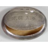 A silver oval tobacco box, Birmingham 1902, of squeeze opening form, 8 x 6 cm, 2 oz.