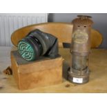 A Thomas and Williams miners lamp, together with a WWII gas mask (2)