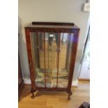 A mirror backed glazed display cabinet with glass shelves 110 x 59 cm