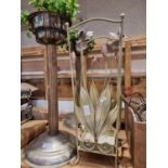 A pair of plated plant stands together with a floral umbrella stand, candlestick holders and glass