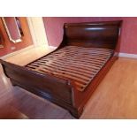 A mahogany sleigh bed, super king size, complete with base and mattresses