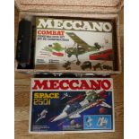 A suitcase and contents to include, Meccano sets 'Combat' & 'Space 250i' and a Suga tape cassette