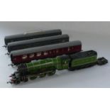 A green Hornby OO Gauge L.N.E.R 'Flying Scotsman' 4472, together with a Hornby L.M.S maroon carriage