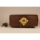 An early unusual 20th Century 'His Masters Voice' radio, clock, alarm combination set. 30cm wide.