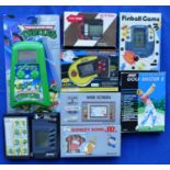 A collection of handheld electronic game consoles form the 1980s/90s including Nintendo Donkey