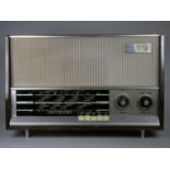 A 1960's valve radio. FM, MW and LW. Checked and working. Tuning indicator. Wooden case, with feet