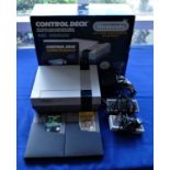 A Nintendo NES games console S No PM1679604 boxed with manual, two control pads, power supply, TV