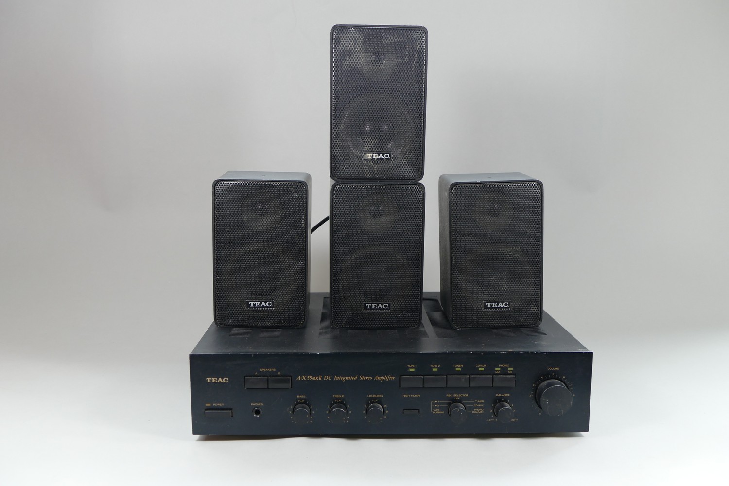 A Teac integrated stereo amplifier, model number A-X55 MK2 complete with four Teac 2-way speakers