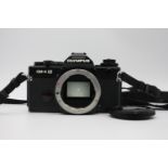 A Olympus OM-4 Ti SLR Film w/ Body Cap & Camera Strap