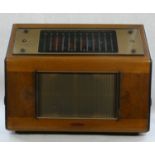 A Pye wood cased table top valve radio 'The Cambridge International' 43cm tall, 59cm wide, 25cm