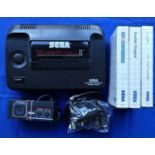 A Sega Master System 2 complete with power supply, control pad, TV lead and three games, TransBot,