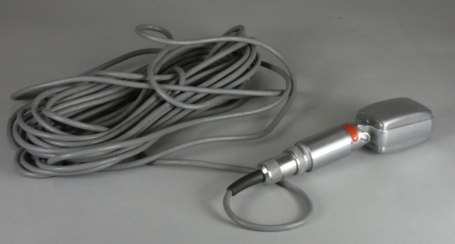 A Reslosound Ltd polished aluminium microphone 30/50 OHMS, complete with connecting plug and lead.