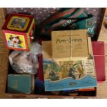 A Mettoy tinplate 'Jack In The Box' toy together with a suitcase and contents of early games to