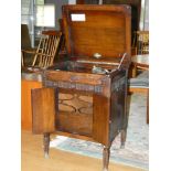 A wind-up record player in large ornate cabinet on legs, includes handle and some needles. 3