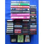 A collection of Atari 2600 game console cartridges titles to include Jungle Book, Mario Bros,