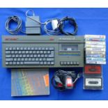 A Spectrum +2 games console (grey) S. No U-013334 together with power supply unit, TV lead,