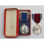 A 1937 George VI and Elizabeth Coronation medal, case and a 1935 George V and Mary Jubilee medal (