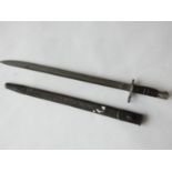 A Remington M1917 bayonet, the 43cm singled edged fullered blade marked 1917 Remington with an eagle