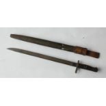 A Remington M1917 bayonet, the 43cm singled edged fullered blade marked 1917 Remington with an eagle