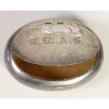 A silver oval tobacco box, Birmingham 1902, of squeeze opening form, 8 x 6 cm, 2 oz.