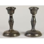 A pair of silver candlesticks, Birmingham 1956, 10.5cm, loaded.