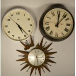 A collection of clocks to include, a Metamec sunburst clock, a Magneta wall clock and a Smith Astral