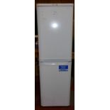 A freestanding Indesit fridge freezer, 173 x 54 cm