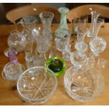 A selection of crystal glassware to include vases, water jugs, and paperweights.