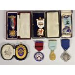 A silver gilt and enamel Jeanne D'Arc Chapter Masonic medal, two silver medals and two gilt metal