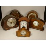 A collection of clocks to inclide, Wm Widdop mantel clocks and other wooden mantel clocks