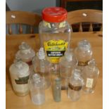 A collection of eight Victorian chemist medicine bottles and a glass sweets bottle.