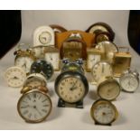 A collection of clocks to include, metal alarm clocks, mantel clocks and quartz carriage clocks