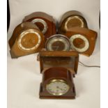 A collection of clocks to include, a tin-plate quartz carriage clock, a wooden Smiths Setric