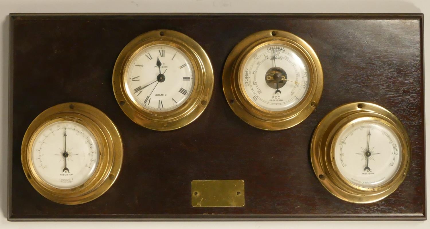 A FCC, precision, a combination thermometer, quartz clock, barometer, humidity bulk head