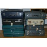 A selection of eight 20th Century suitcases.