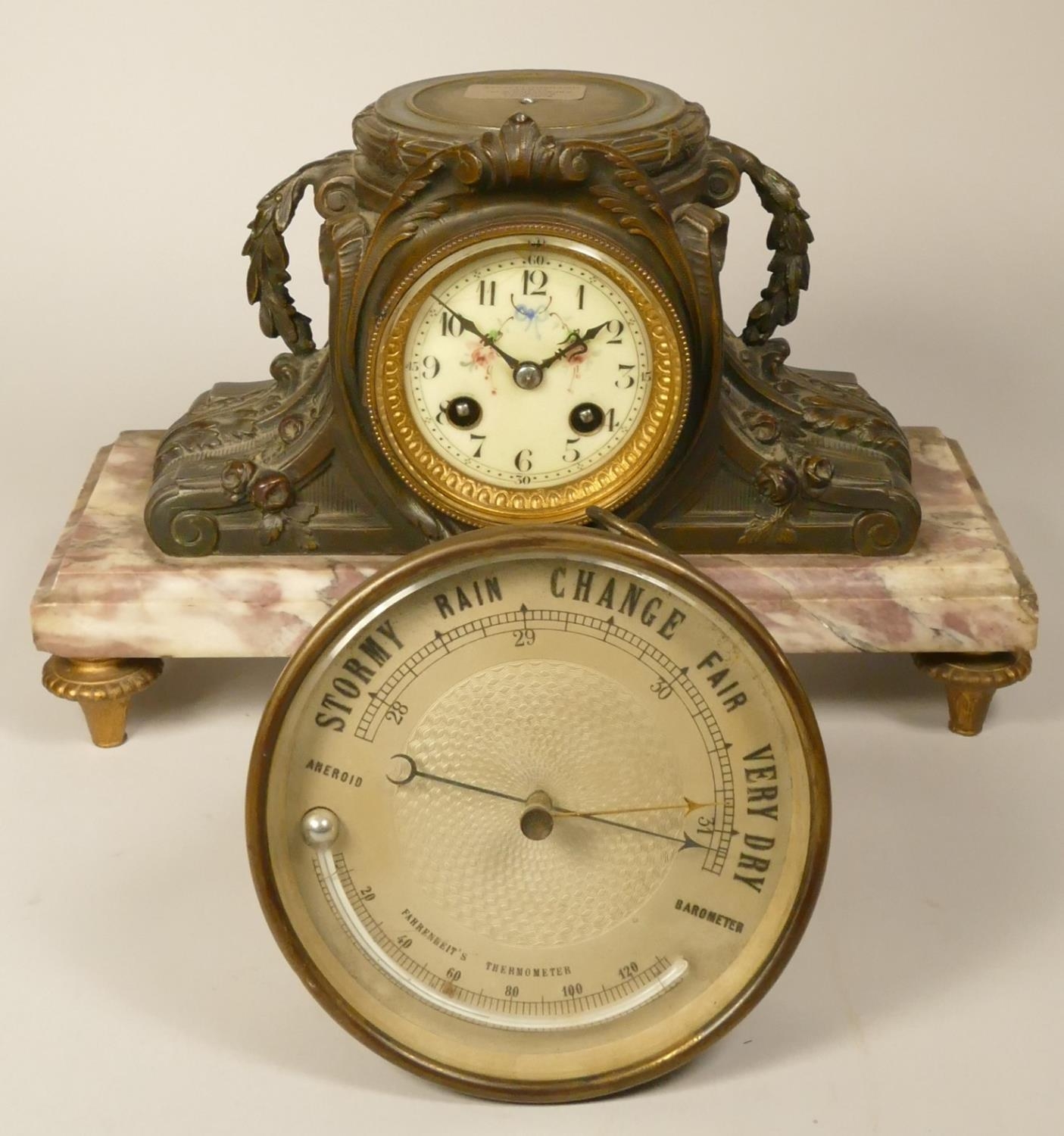 A Aneriod barometer and thermometer, diameter 14 cm, together with a french mantel clock on a onyx