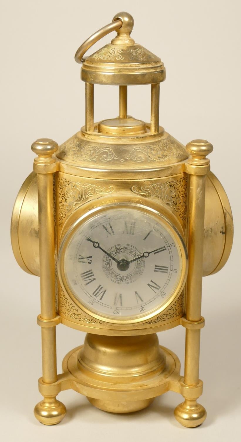 A brass desk compendium, comprising quartz clock, barometer, thermometer and compass, height 25 cm