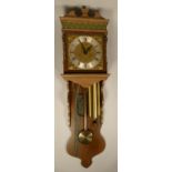 A collection of clocks to include, a large wooden wall clock complete with pendulum and weights, a