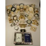 A collection of clocks to include, ornamental quartz clocks