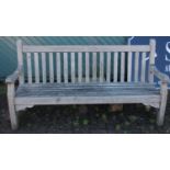 A hardwood garden bench. 182cm long. (matching previous lot)