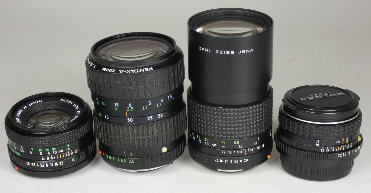 Four camera lenses, including a Pentax-M 28mm F/3.5 Lens w/ Original Lens Caps, together with a