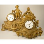 A 19th century French gilt metal, figural mantel clock, surmounted by a hunter, height 32 cm,