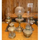 A collection of five brass and copper oil lamps, including chimeras. (5)