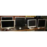 A collection of eleven computer monitors, makers to include, Acer & Dell, together with nine